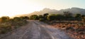 Sunrise over farm road and Cockscomb Mountains Royalty Free Stock Photo