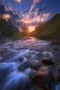 Sunrise over fast mountain river Royalty Free Stock Photo
