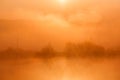 Sunrise over foggy lake Royalty Free Stock Photo