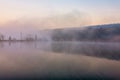 Sunrise over foggy lake Royalty Free Stock Photo