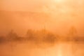 Sunrise over foggy lake Royalty Free Stock Photo