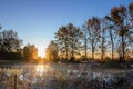 Sunrise over a foggy lake on a cold autumn morning Royalty Free Stock Photo