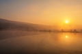 Sunrise over foggy lake Royalty Free Stock Photo