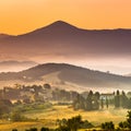 Sunrise over foggy Tuscany village Royalty Free Stock Photo