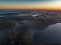 Sunrise over forests and lakes - drone view