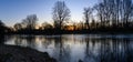 Sunrise over a frozen lake in the municipality of Deurne.