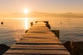 Sunrise over Frozen Wood Pier, Leman Lake and Iconic Snowy Mont- Royalty Free Stock Photo