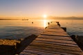 Sunrise over Frozen Wood Pier, Leman Lake and Iconic Snowy Mont- Royalty Free Stock Photo