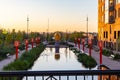 Sunrise over Gene Leahy mall with golden glow on surrounding buildings