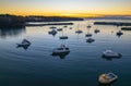 Sunrise over the harbour with low cloud bank and boats