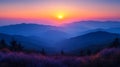 Sunrise over hazy mountain range, autumn foliage foreground Royalty Free Stock Photo