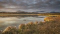 Sunrise over Hjerkinnsdammen lake, Dovre mountains. Dovrefjell-Sunndalsfjella national park, Norway Royalty Free Stock Photo