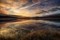 Sunrise over Hjerkinnsdammen lake, Dovre mountains. Dovrefjell-Sunndalsfjella national park, Norway Royalty Free Stock Photo