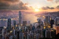 Sunrise over Hong Kong Victoria Harbor from Victoria Peak with Hong Kong and Kowloon below. Asian tourism, modern city life, or Royalty Free Stock Photo
