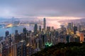 Sunrise over Hong Kong Victoria Harbor from Victoria Peak with Hong Kong and Kowloon below. Asian tourism, modern city life, or Royalty Free Stock Photo