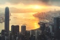 Sunrise over Hong Kong Victoria Harbor from Victoria Peak with Hong Kong and Kowloon below. Asian tourism, modern city life, or Royalty Free Stock Photo