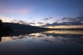 Sunrise over the lake. Colorful morning sky with the water reflection on nature lake landscape. Blue sky clouds over horizon. Royalty Free Stock Photo