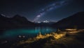 sunrise over the lake _A night landscape with a colorful milky way and yellow light from the mountains. Royalty Free Stock Photo