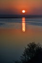 Sunrise over the lake, reflection of the red rays of the sun in the water, Ukraine, Tiligulsky estuary Royalty Free Stock Photo