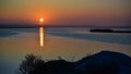 Sunrise over the lake, reflection of the red rays of the sun in the water, Ukraine, Tiligulsky estuary Royalty Free Stock Photo