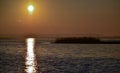 Sunrise over the lake, reflection of the red rays of the sun in the water, Ukraine, Tiligulsky estuary Royalty Free Stock Photo