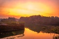 Sunrise over the lake with trees at Ranu Manduro, Mojokerto, Indonesia.