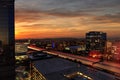 Sunrise over light trails and city lights