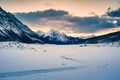 Sunrise over Medicine Lake with rocky mountains and frozen lake in Jasper national park Royalty Free Stock Photo