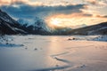 Sunrise over Medicine Lake with rocky mountains and frozen lake in Jasper national park Royalty Free Stock Photo