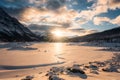 Sunrise over Medicine Lake with rocky mountains and frozen lake in the morning Royalty Free Stock Photo