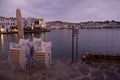 Sunrise over the Mediterranean Sea, with boats and seagulls in Cadaques, Spain