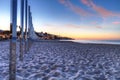 Sunrise over mirrored posts at Main Beach in Laguna Beach