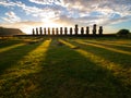 Sunrise over Moai stone sculptures at Ahu Tongariki, Easter island, Chile.