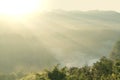 Sunrise over the mountain landscape with beautiful sun rays