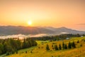 Sunrise over the Mountains and Fog in the Valley Royalty Free Stock Photo