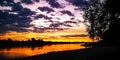 Sunrise over the natural sand beach shore at the riverside of the river Rhein in Cologne Royalty Free Stock Photo