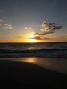 Sunrise over the ocean horizon Cancun Mexico beach sun sky clouds sunlight reflection travel tourism Royalty Free Stock Photo