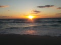 Sunrise over the ocean horizon Cancun Mexico beach sun sky clouds sunlight reflection travel tourism Royalty Free Stock Photo