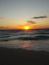 Sunrise over the ocean horizon Cancun Mexico beach sun sky clouds sunlight reflection travel tourism Royalty Free Stock Photo