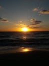 Sunrise over the ocean horizon Cancun Mexico beach sun sky clouds sunlight reflection travel tourism Royalty Free Stock Photo