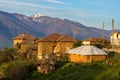 Sunrise over old houses in a mountain vilage