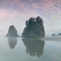 Sunrise over the Pacific through sea arches at a beach in Olympic National Park,  La Push, Washington, USA West coast Royalty Free Stock Photo