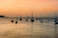 Small boats moored and at far end ships waitng to go through the canal. Royalty Free Stock Photo