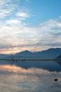 Sunrise over partially submerged dead tree branches in Lake Isabella in the Sierra Nevada mountains in central California USA