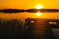 sunrise over the pier over the lake Wigry in Poland Royalty Free Stock Photo