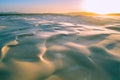 Sunrise over pristine sand dunes. Royalty Free Stock Photo