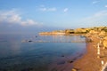 Sunrise over the red sea. Beautiful bright sky with sun rays and morning clouds. Sea and boats. View of Tiran Island. Egypt, Sharm