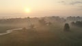 Sunrise over riparian forest with tortuous river meanders in summer