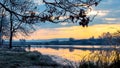 Sunrise over the river, frost-covered grass   on the shore river in the morning, reflection of the sky in the river Royalty Free Stock Photo