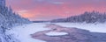 Sunrise over a river in a winter landscape, Finnish Lapland Royalty Free Stock Photo